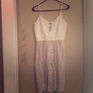White and tan lace cocktail dress.